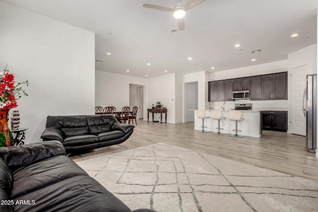 3842 E Bartlett Way, Chandler, AZ 85249 - living area with a ceiling fan, recessed lighting, and light wood-type flooring