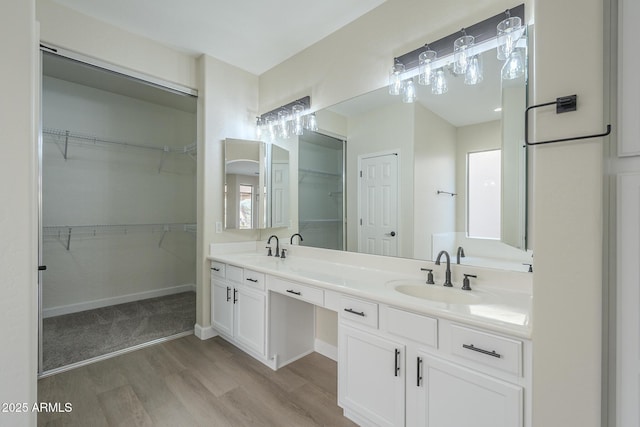 bathroom featuring hardwood / wood-style flooring and vanity