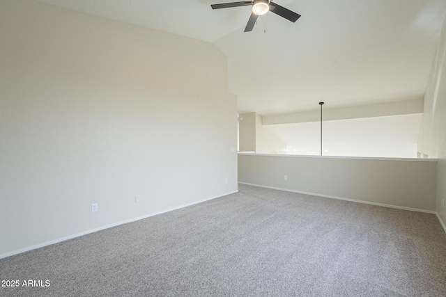 empty room with carpet flooring, ceiling fan, and lofted ceiling