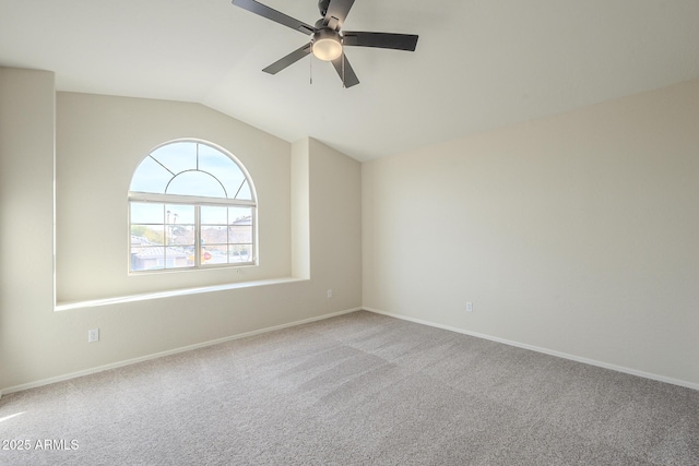 unfurnished room featuring ceiling fan, light carpet, and vaulted ceiling