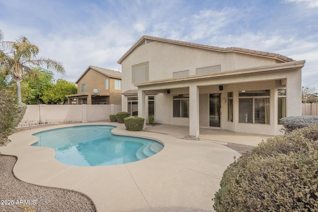 view of swimming pool with a patio area