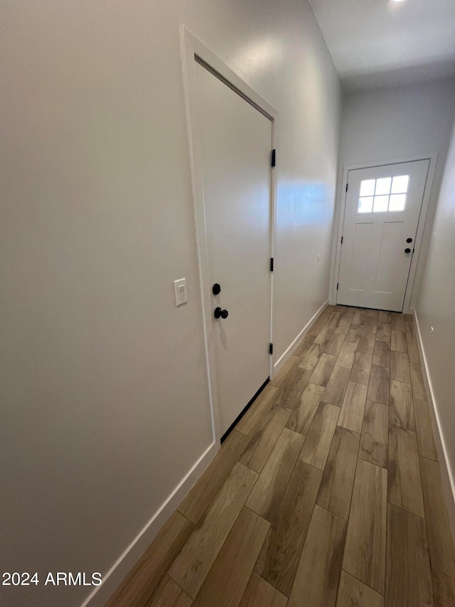 corridor featuring light hardwood / wood-style floors