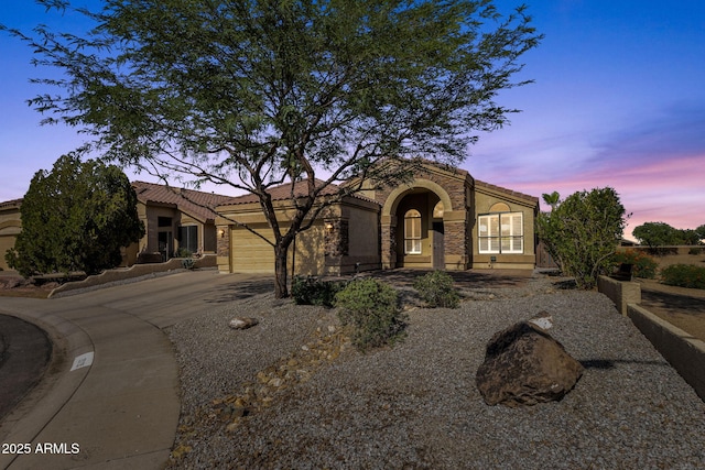 20239 N 39th Dr, Glendale, AZ 85308 - view of front facade with driveway, an attached garage, stucco siding, and a tile roof