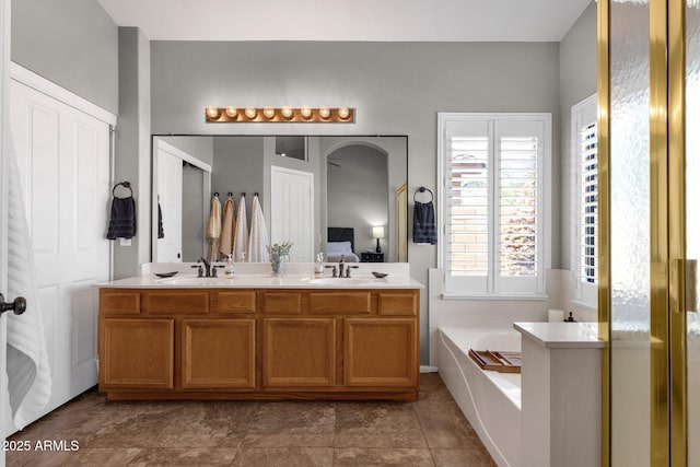 20239 N 39th Dr, Glendale, AZ 85308 - ensuite bathroom featuring a garden tub and double vanity
