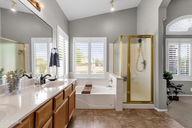 20239 N 39th Dr, Glendale, AZ 85308 - bathroom with a shower stall, a bath, lofted ceiling, healthy amount of natural light, and double vanity