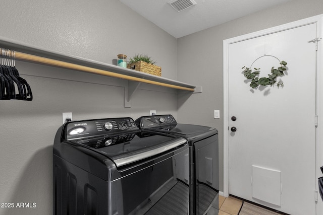 20239 N 39th Dr, Glendale, AZ 85308 - laundry area with washer and dryer and light tile patterned flooring