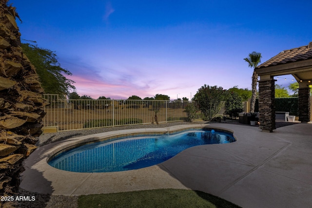 20239 N 39th Dr, Glendale, AZ 85308 - pool at dusk featuring a patio and a fenced backyard