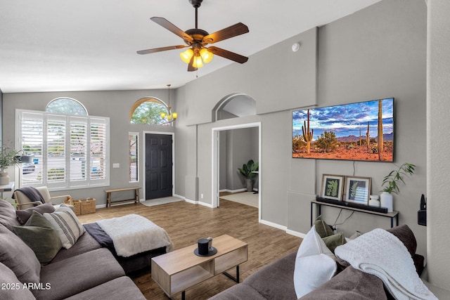 20239 N 39th Dr, Glendale, AZ 85308 - living room with a ceiling fan, wood finished floors, lofted ceiling, and baseboards