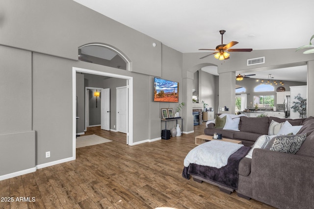 20239 N 39th Dr, Glendale, AZ 85308 - living area with a ceiling fan, wood finished floors, arched walkways, baseboards, and high vaulted ceiling