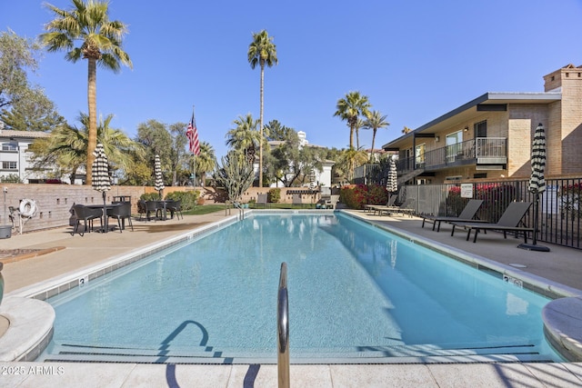 view of swimming pool featuring a patio