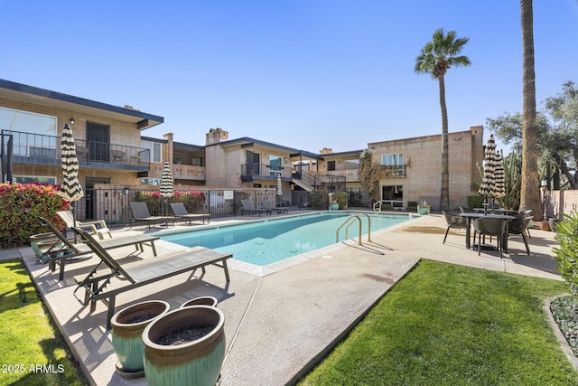 view of swimming pool featuring a patio area