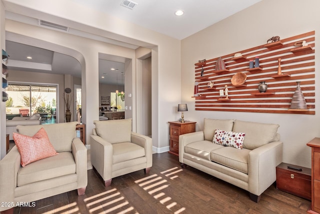 living room featuring dark wood-type flooring