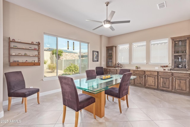 dining area featuring light tile patterned flooring and ceiling fan