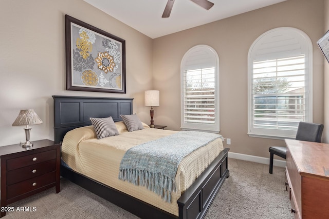 bedroom featuring light colored carpet and ceiling fan