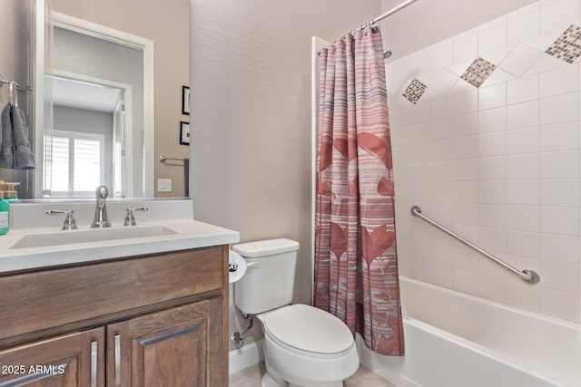 full bathroom featuring vanity, shower / tub combo, and toilet