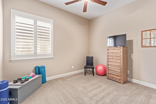 interior space featuring ceiling fan and carpet