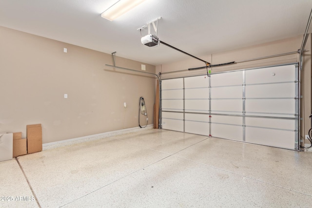 garage featuring a garage door opener