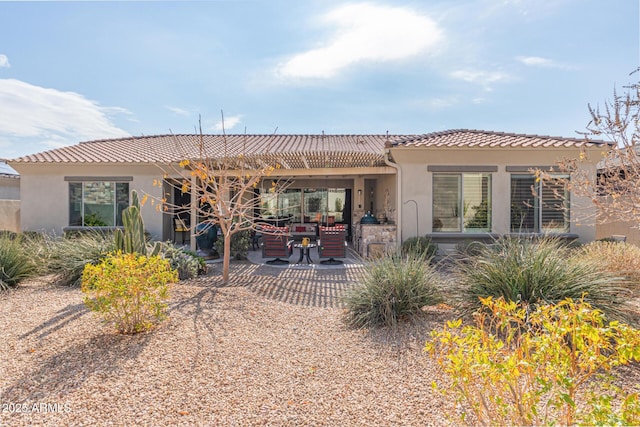 back of house with a patio area