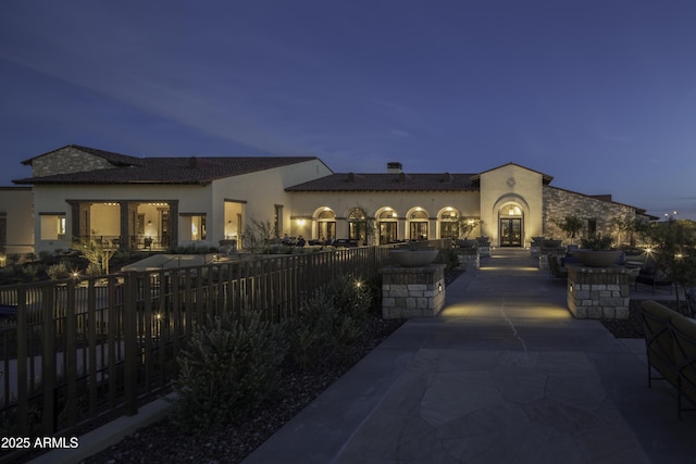 mediterranean / spanish home with a patio area