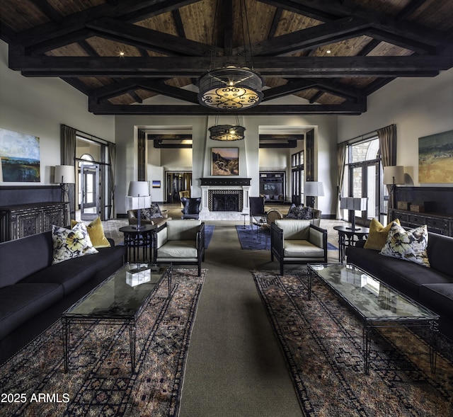 living room with wood ceiling, carpet floors, high vaulted ceiling, and beamed ceiling