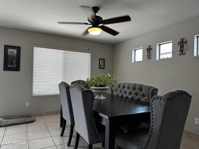 6538 W Nez Perce St, Phoenix, AZ 85043 - dining space with ceiling fan, light tile patterned floors, and baseboards