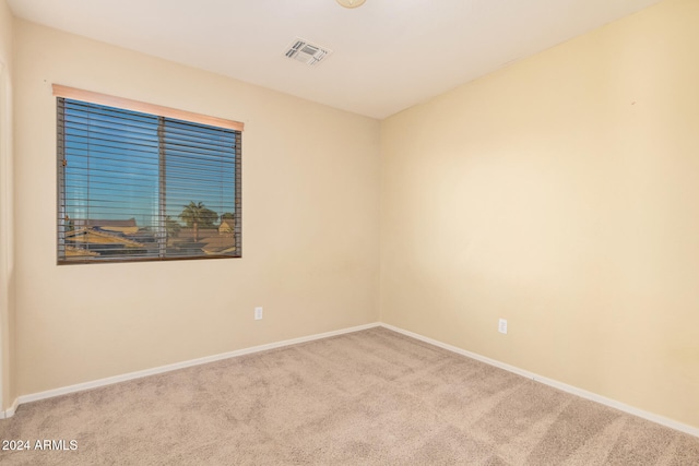 unfurnished room with light carpet