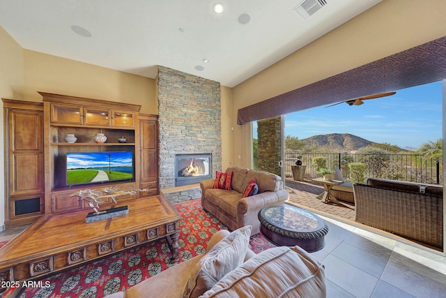 living room featuring tile patterned flooring and a fireplace