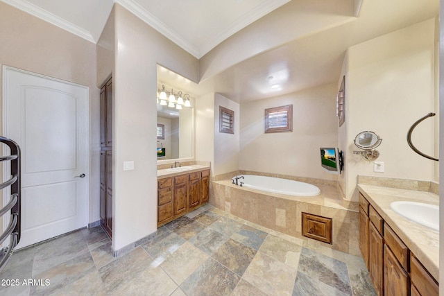 bathroom featuring vanity, ornamental molding, and tiled bath