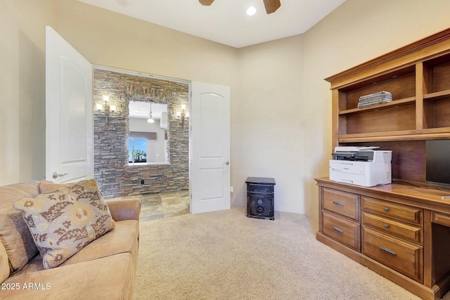 living room with light colored carpet and ceiling fan