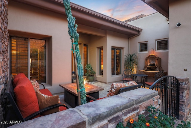 patio terrace at dusk with an outdoor hangout area