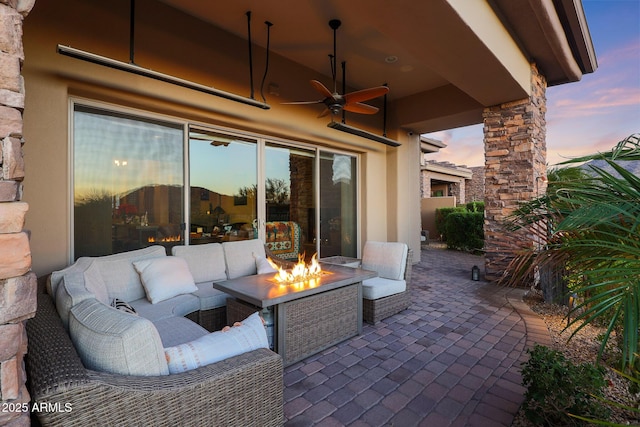 patio terrace at dusk with ceiling fan