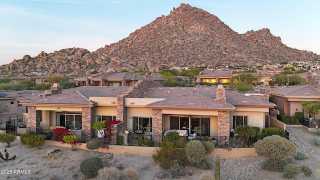 view of front of home featuring a mountain view