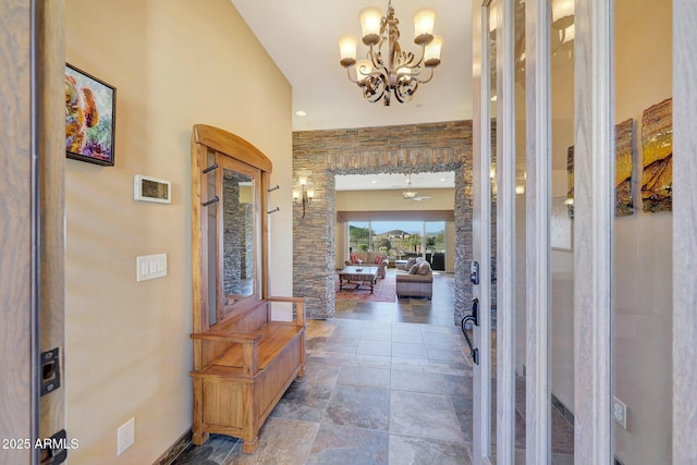 foyer entrance featuring a notable chandelier