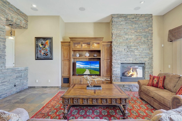 living room featuring a fireplace