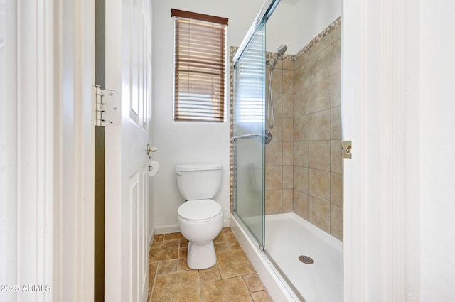 10253 E Indigo Dr, Scottsdale, AZ 85255 - full bath with a stall shower, toilet, baseboards, and tile patterned floors