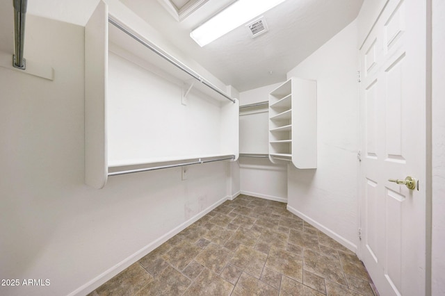 10253 E Indigo Dr, Scottsdale, AZ 85255 - spacious closet featuring stone finish floors
