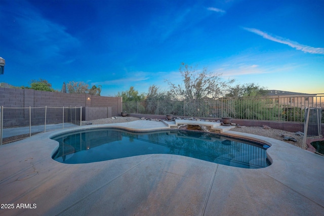 10253 E Indigo Dr, Scottsdale, AZ 85255 - pool at dusk with a fenced backyard and a patio area