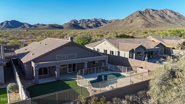 10253 E Indigo Dr, Scottsdale, AZ 85255 - rear view of house with a fenced backyard, a patio, stucco siding, and a mountain view