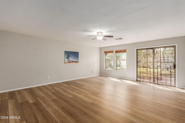 spare room featuring light hardwood / wood-style floors and ceiling fan