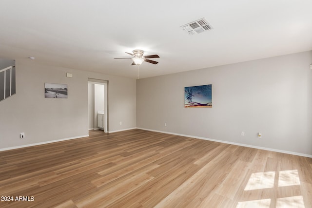 unfurnished room with ceiling fan and light hardwood / wood-style floors