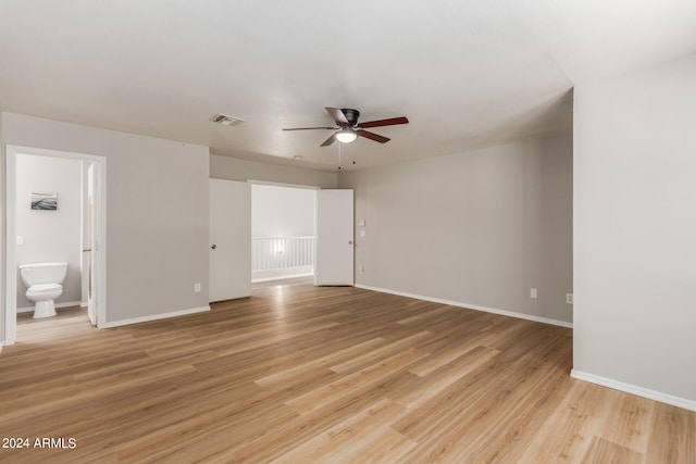 spare room with ceiling fan and light hardwood / wood-style floors