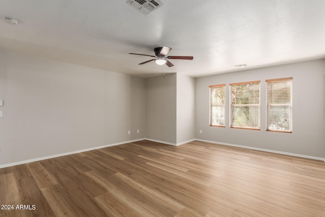 spare room featuring ceiling fan and light wood-type flooring