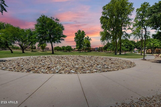 view of property's community with a lawn