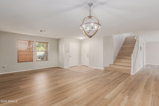 entryway with a chandelier and light hardwood / wood-style floors