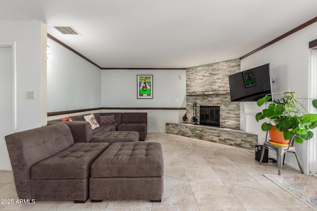 living room with crown molding and a large fireplace
