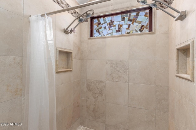bathroom featuring a shower stall