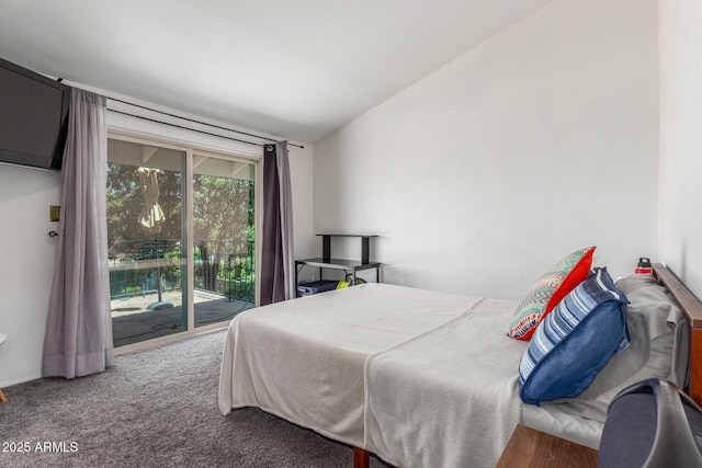 carpeted bedroom featuring vaulted ceiling and access to outside