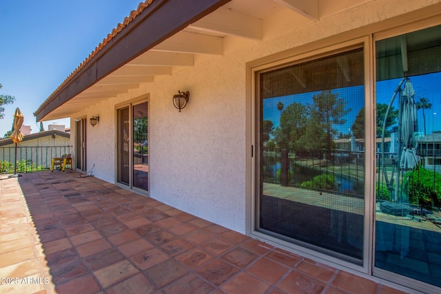 view of patio / terrace featuring fence