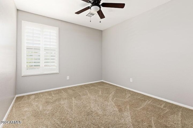 spare room with ceiling fan and carpet floors