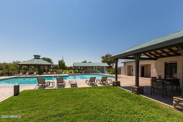 view of swimming pool with a lawn, a patio area, and a gazebo